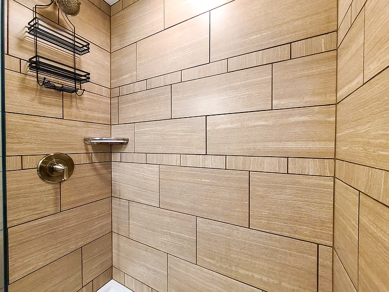 Bathroom 1/3 - Fully tiled master bathroom shower.