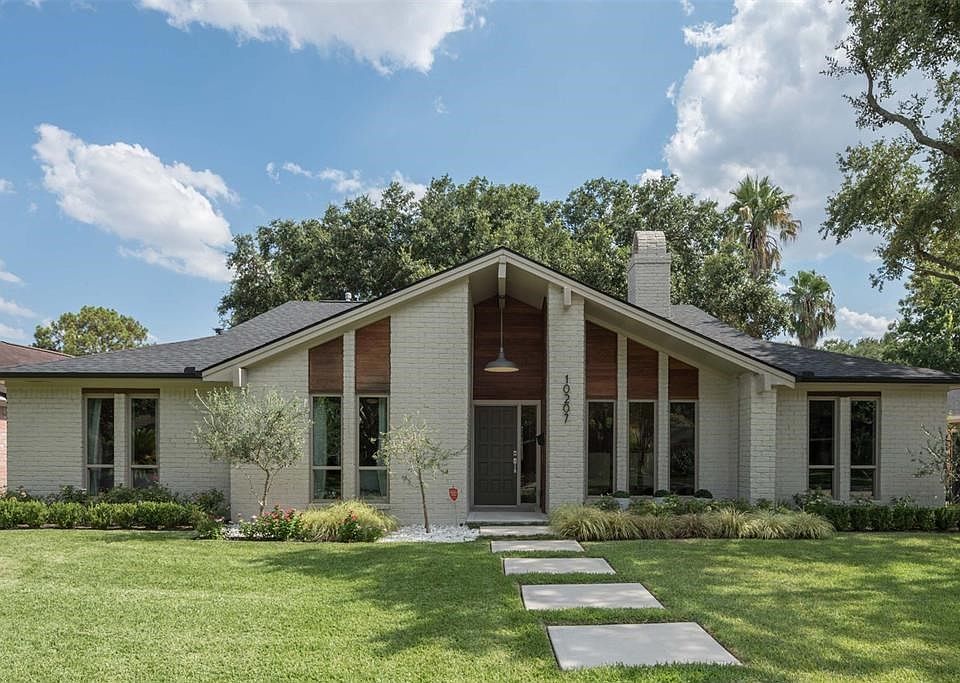 Sophisticated soft contemporary with beautiful curb appeal.