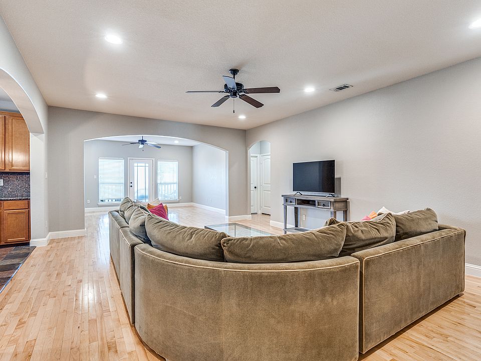 2700 Merida | Walking distance to TCU | Front area of living space, with door to upstairs balcony