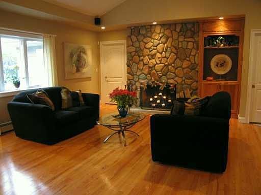 Very large living room with stone fireplace