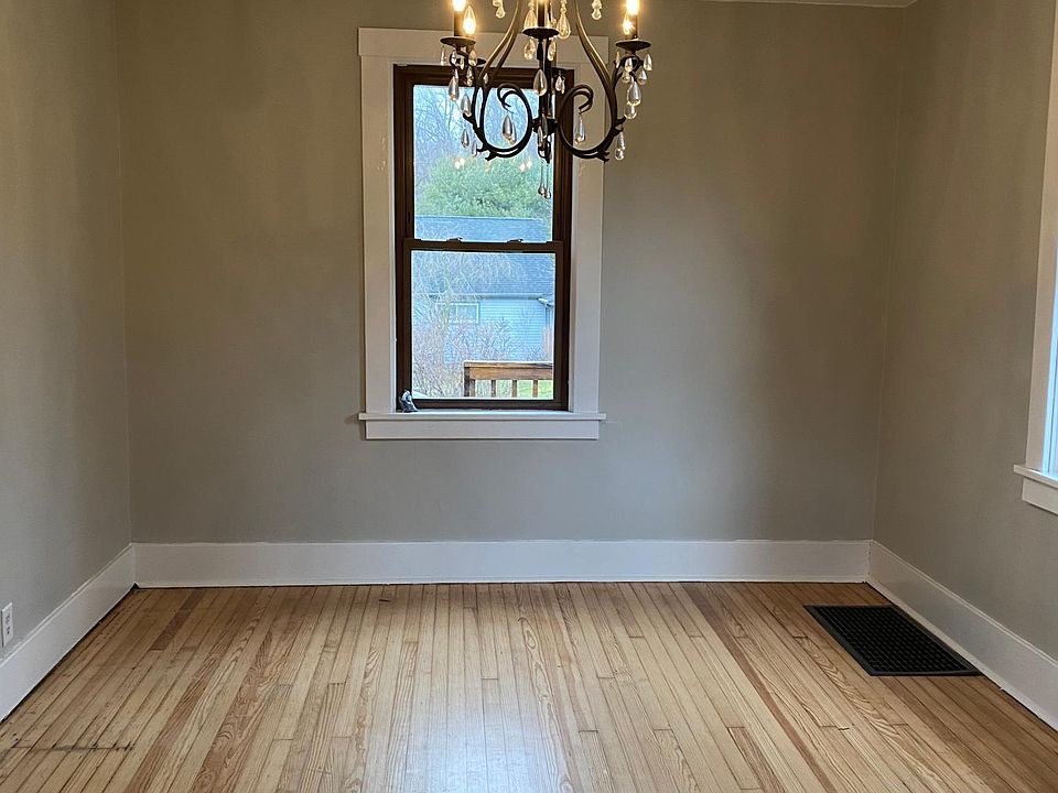 Dining room with chandelier with Pottery Barn style chandelier. This room is perfect for your holiday dinner!