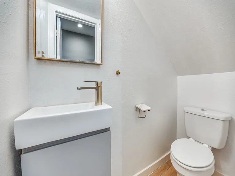 Powder bathroom located on the 1st floor