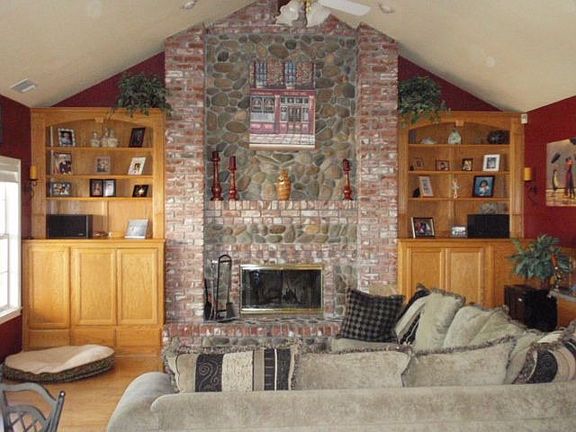 A grand family room! TV hidden behind oak cabinets. 9' wet bar to right.
