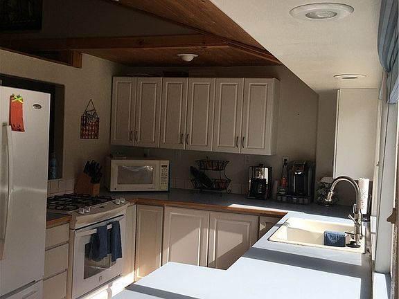 Kitchen view w/gas range.