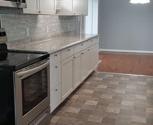 Galley kitchen with dining area