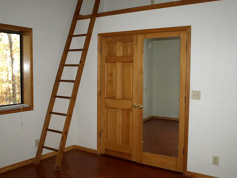 Bedroom closet and storage loft area