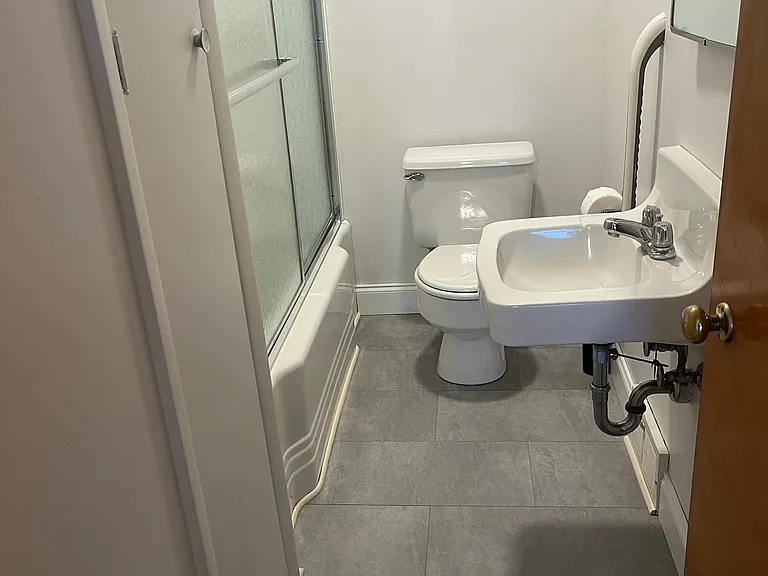 New bathroom floor tile, fresh paint, new shower doors, new shower surround, new shower fixtures, new fan/led light, linen closet in bathroom
