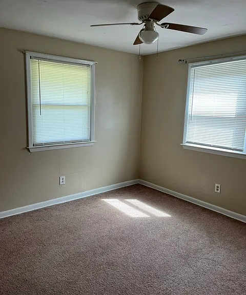 1 bedroom with carpet