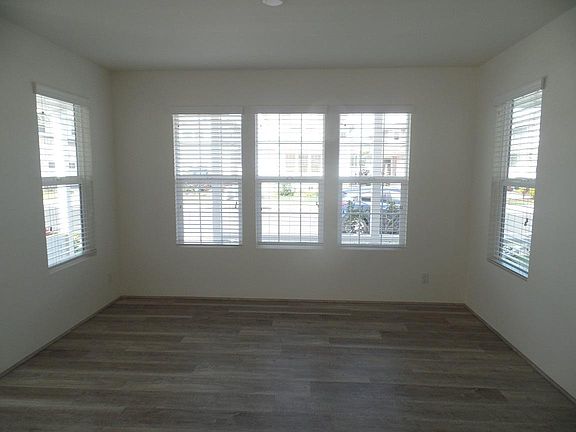 Formal living room lots of natural lighting