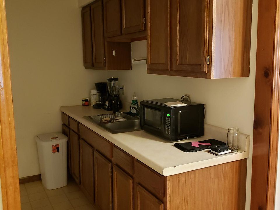 Kitchen showing the cabinets and double sink