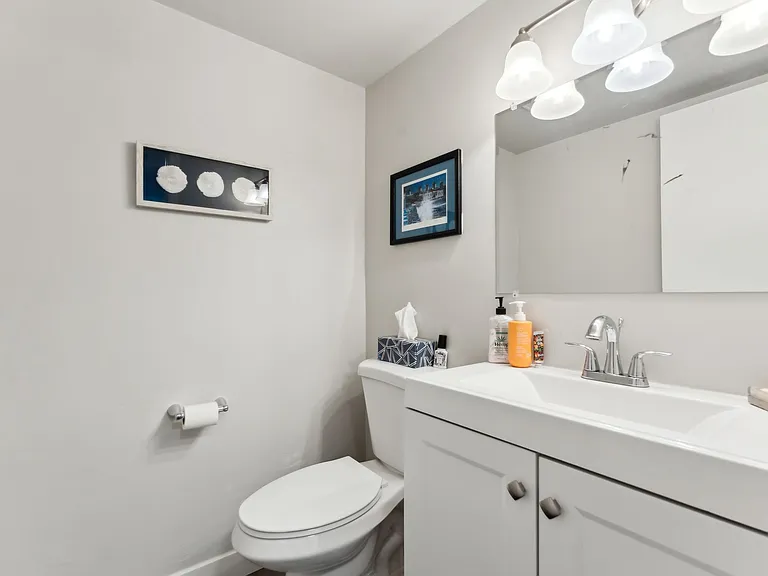 Downstairs bathroom next to living room.
