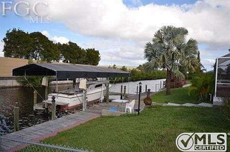 Spacious backyard, with 13,000lb boat lift and canopy.