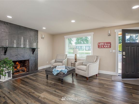 Living room has remote-controlled gas fireplace