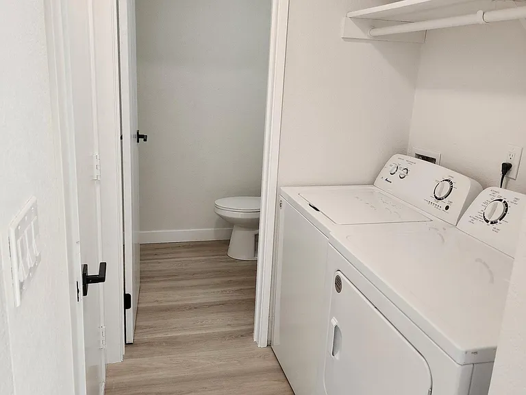 Laundry in unity right off of garage and powder room