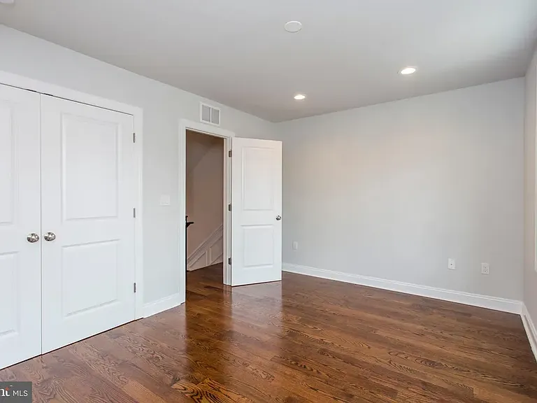 Bedroom on second floor (2nd of 2). Big windows, ample closet space.