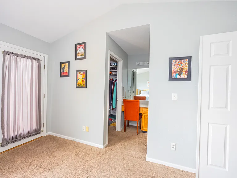 bedroom leading into ensuite bathroom, closet