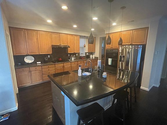 Large spacious kitchen with a lot of cabinets and a remodeled island perfect for large gatherings