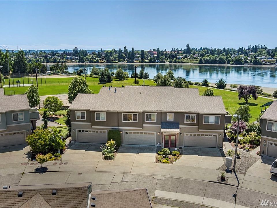 The middle garage door and the red door is your entrance to your beautiful new home. 