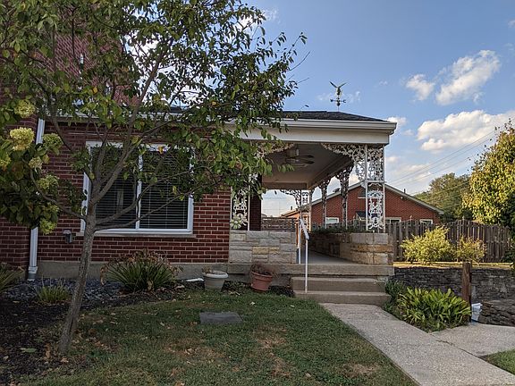 Private entrance from covered porch that wraps around back to a private deck.