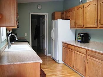 beautiful light oak cabinets and new counter tops and wood flooring