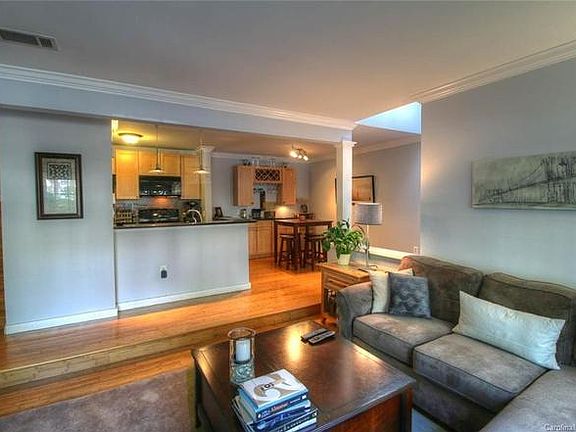 View from living room looking into the kitchen and dining area.