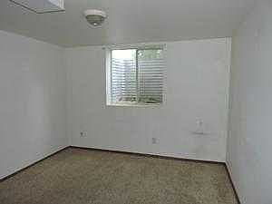 ONE OF TWO BASEMENT BEDROOMS WITH EGRESS WINDOWS