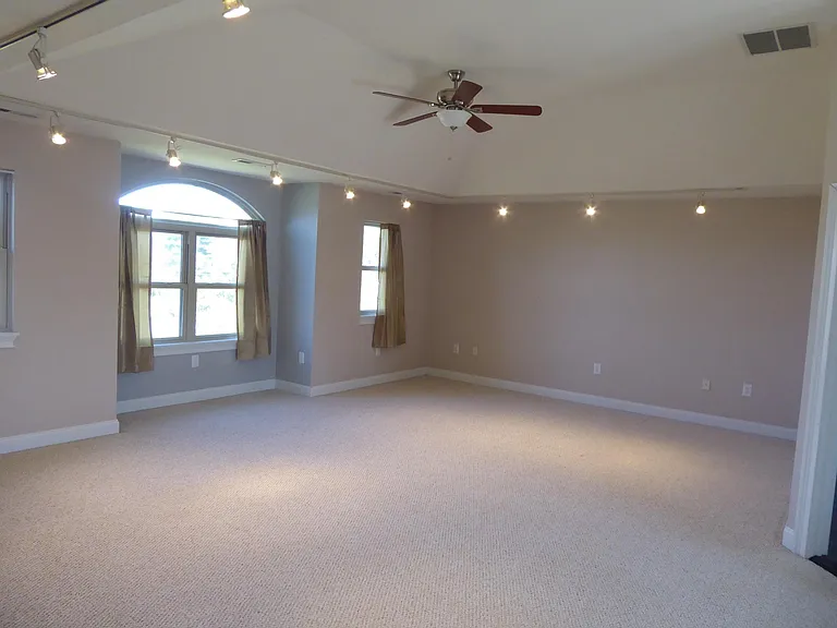 Master bedroom. Has large walk in closet, and additional alcove overlooking back yard and horse pasture.