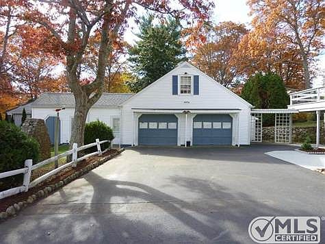 Garage has attached tool shed and garden shed.