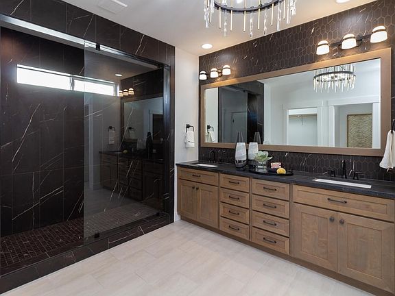 Representative Photo - Lavish primary bath with distinctive tile accents