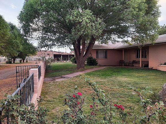 Main home, fenced lawn