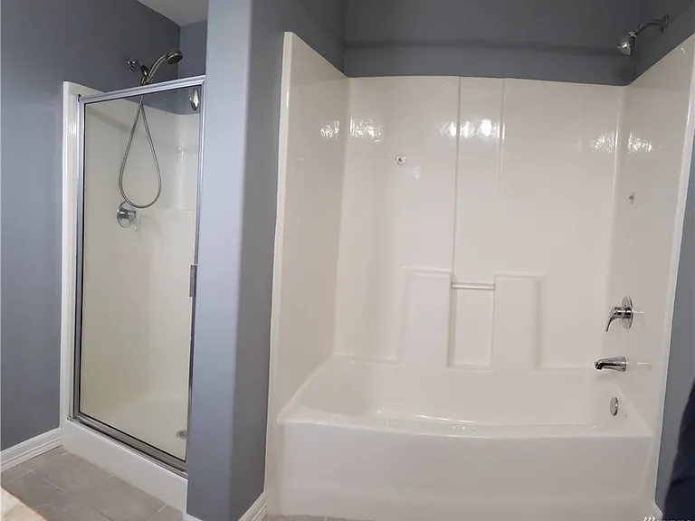 Master bath with standing shower and tub