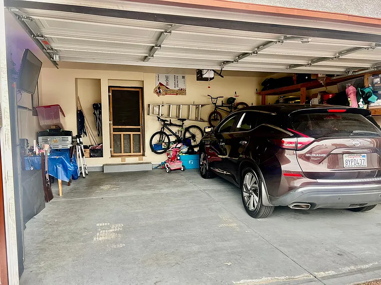 Garage entrance can fit 2 cars outside. Entrance/exit to Home via Garage access w/ Keychain size garage remote. Host as a 2021 Nissan Murano SUV available for an additional fee per day.