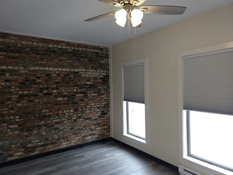 Bedroom facing the north wall and the windows over N. Superior.