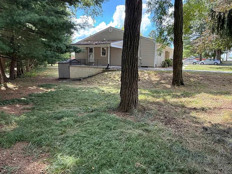 side yard-- beautiful trees add shade and privacy