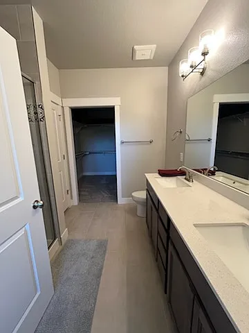 Primary bedroom closet and bath