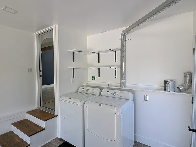 Full laundry with shelving.