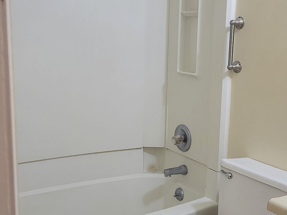 Full bath with tub and toilet.