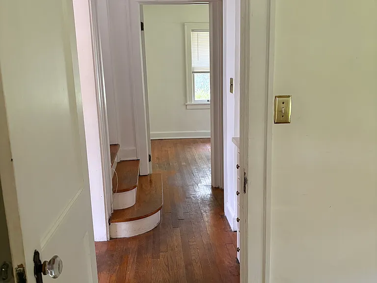 Looking into the downstairs hall towards 2nd bedroom.