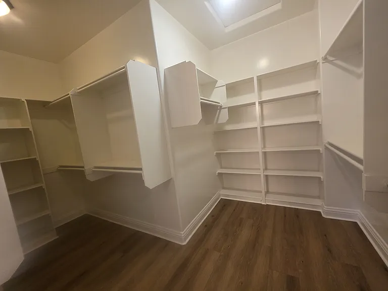 closet space in master suite bathroom