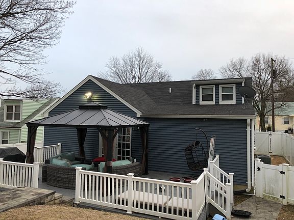 Back of house with deck