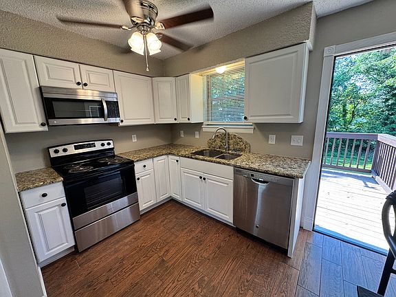 Like New Kitchen Cabinets & Granite countertops and custom deck off kitchen overlooking tree lined peaceful backyard