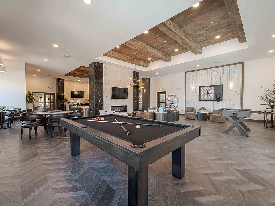The resident clubhouse at Garrett Parker includes a full size billiards table, foosball table, and fireplace lounge for casual games and gathering.