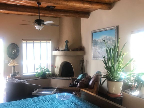 Master suite with Kiva fireplace, vigas, king size bed with tempurpedic mattress.