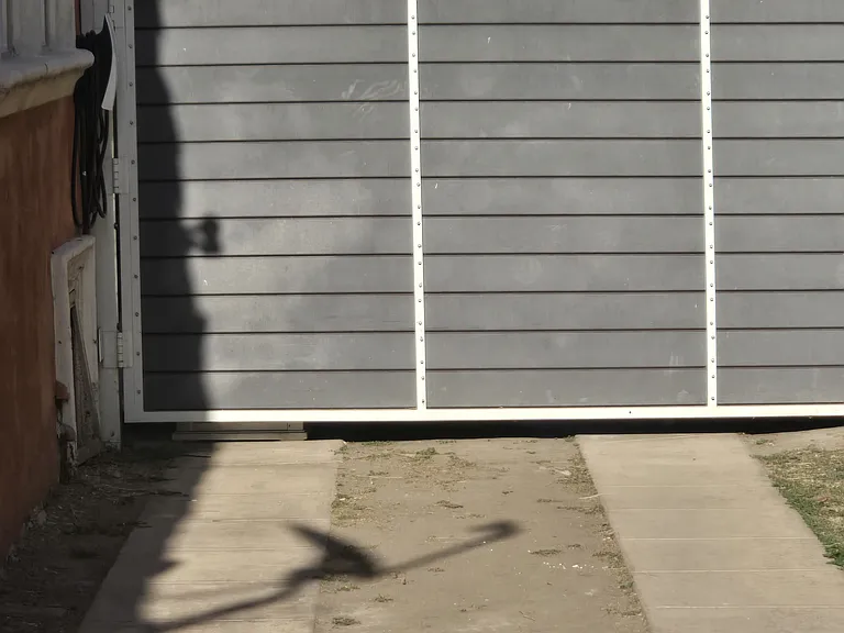 BEHIND GATE CAN PARK APPROXIMATELY 2 CARS