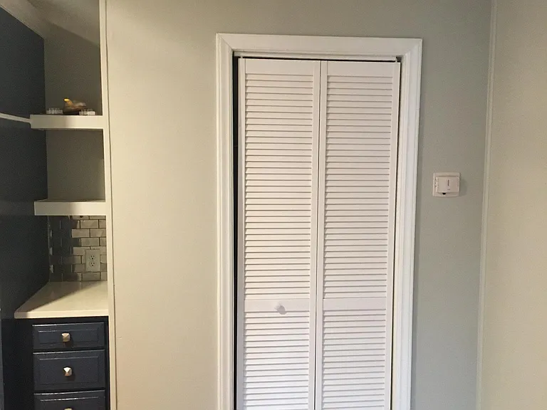 Dining room closets are either sliding doors or shutter style. All dining areas and kitchens have light grey paint.