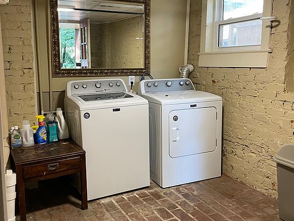 Shared laundry room with one unit
