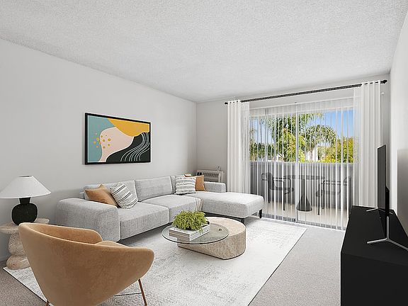 Renovated Package II living room with carpet (select homes)