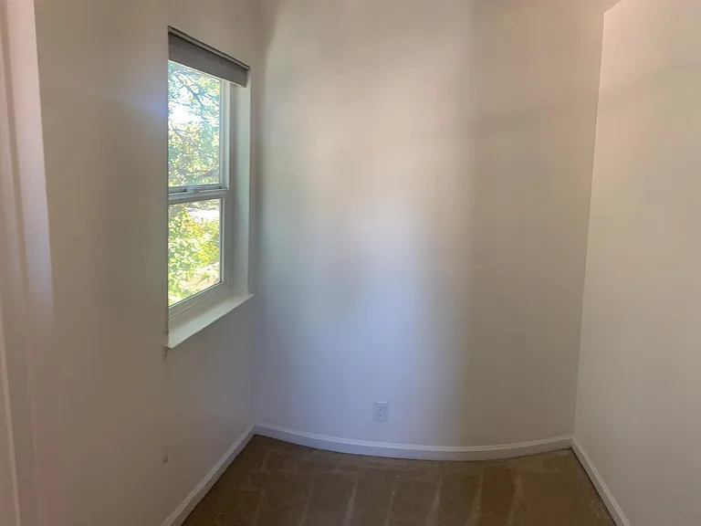 Upstairs bonus small office room with door and window