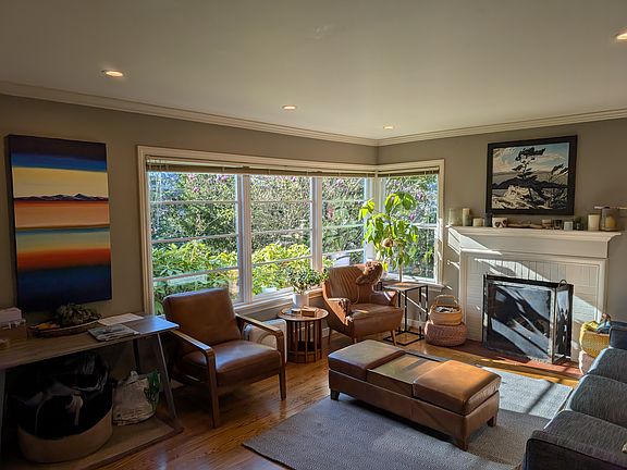 Living room with gas fireplace and new windows