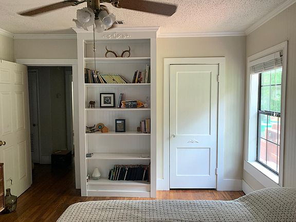 Main bedroom, with built-in bookshelf.